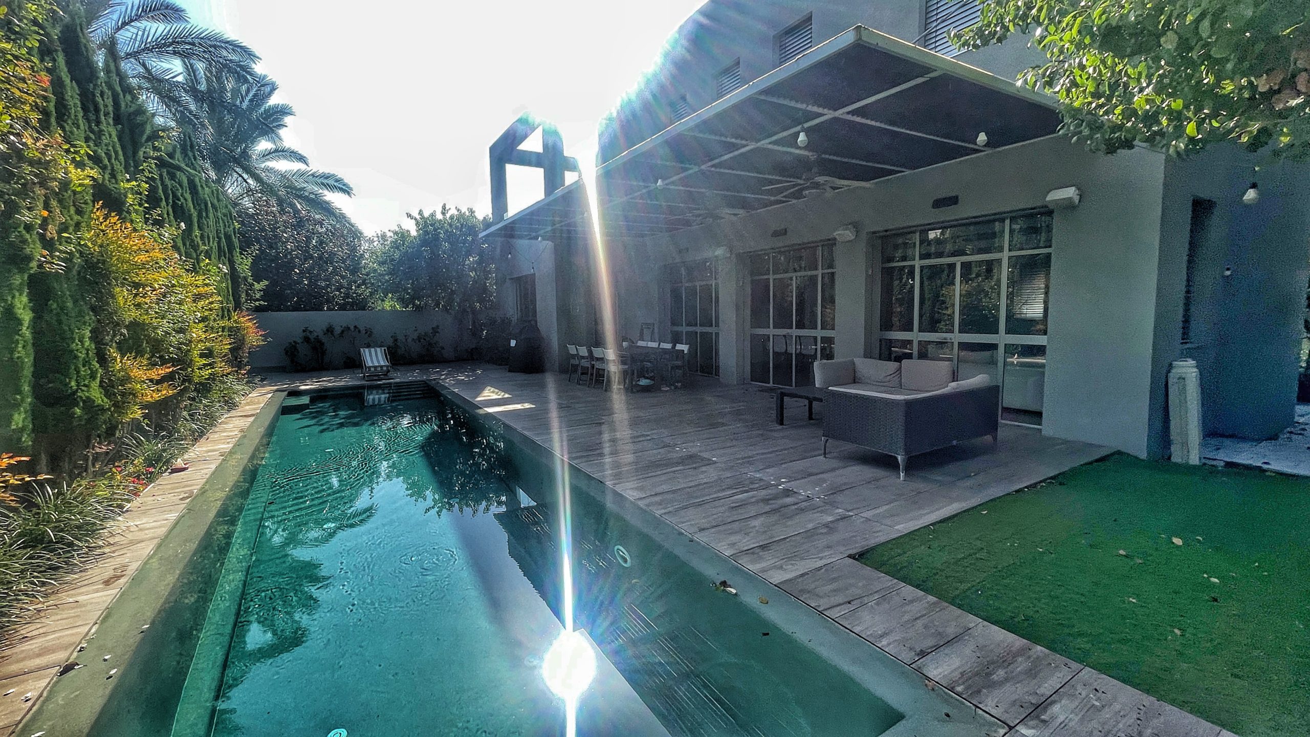 Modern luxury villa Herzliya indoor outdoor living Warm design villa Herzliya Pituach luxury home Open space villa Herzliya Israel modern design Luxury villa with garden and pool Herzliya